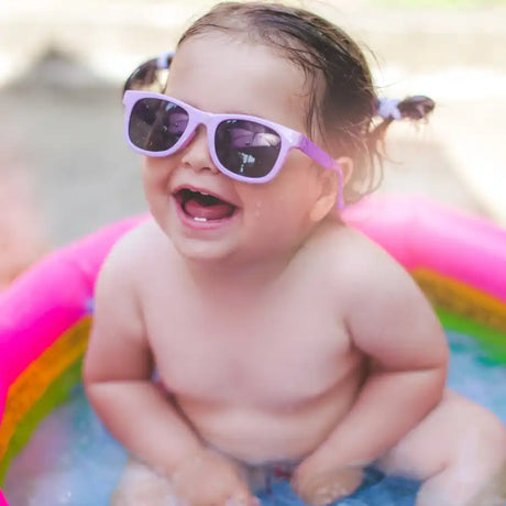 Smiling baby in sunglasses.