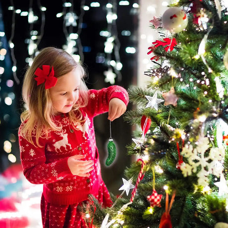 Girl decorating Christmas tree.
